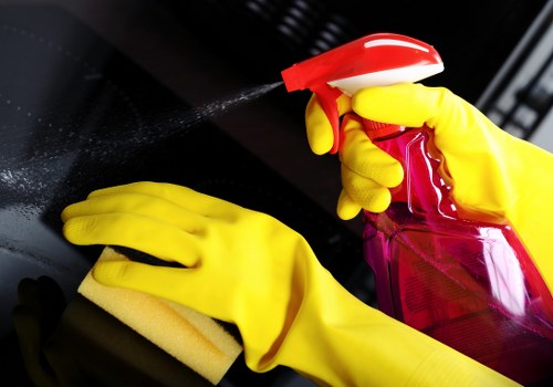 Staff member applying protective equipment during carpet cleaning